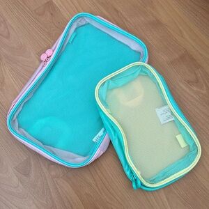Travel Pouch Set (1 Large, 1 Small) with smiley face zipper
Original packaging